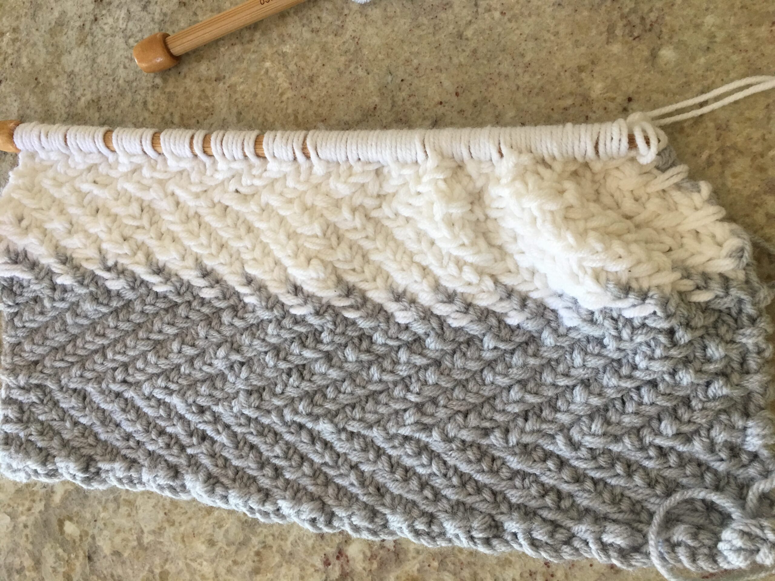 Knit herringbone pillow work in progress on size 15 needles