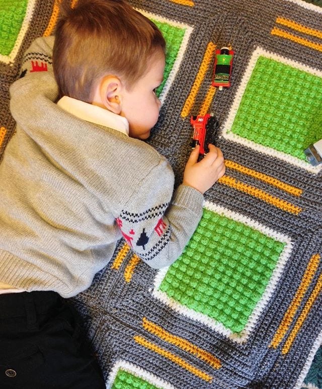 Finished crochet roadway throw — kid-friendly Red Heart pattern made with Red Heart Super Saver