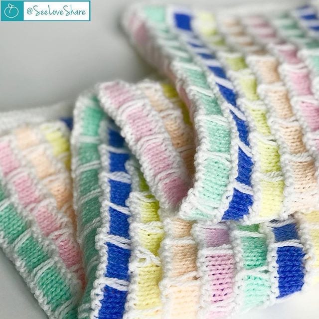 Knit brick and mortar baby blanket pattern in soft neutral colours — beginner knit baby gift