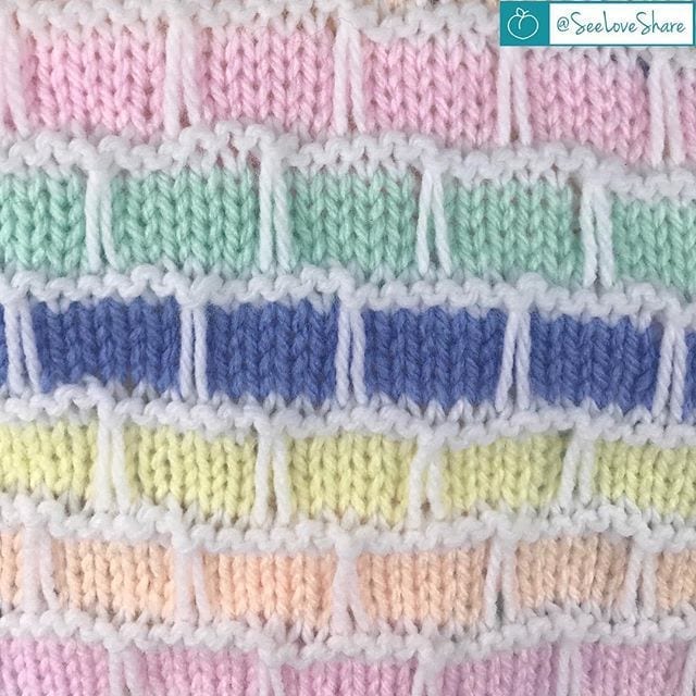 Finished knit brick and mortar baby blanket folded — beginner knit baby shower gift